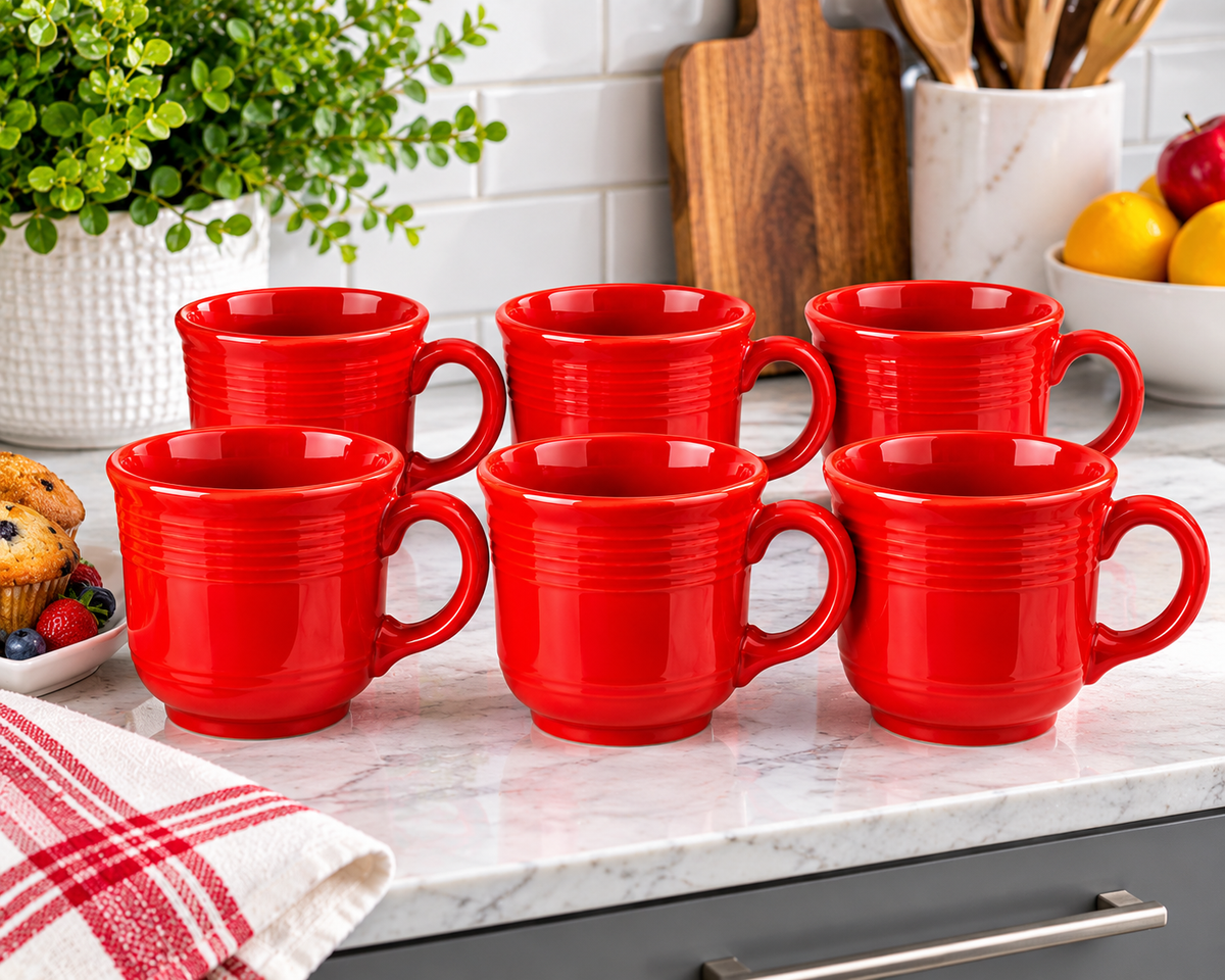Six glossy Scarlet Red Fiesta ceramic mugs displayed in a modern kitchen